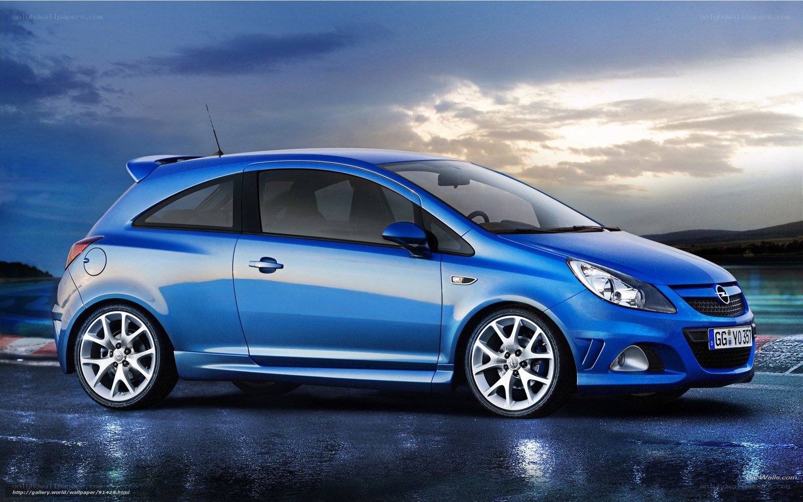Blue Opel Corsa on wet road