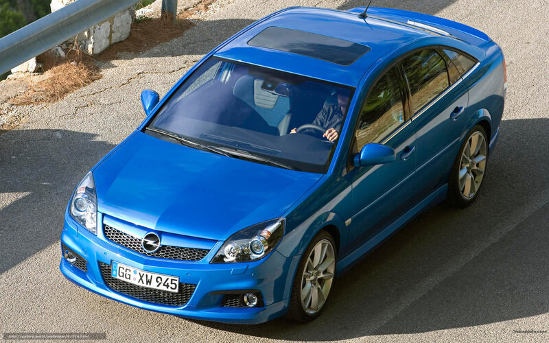 blue opel in motion