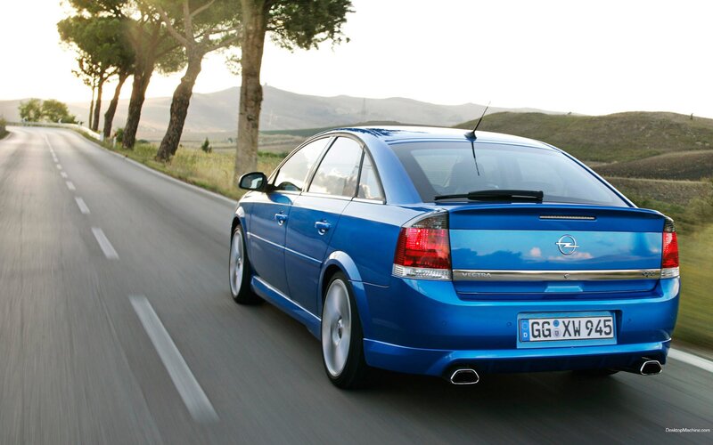blue opel vectra on country road