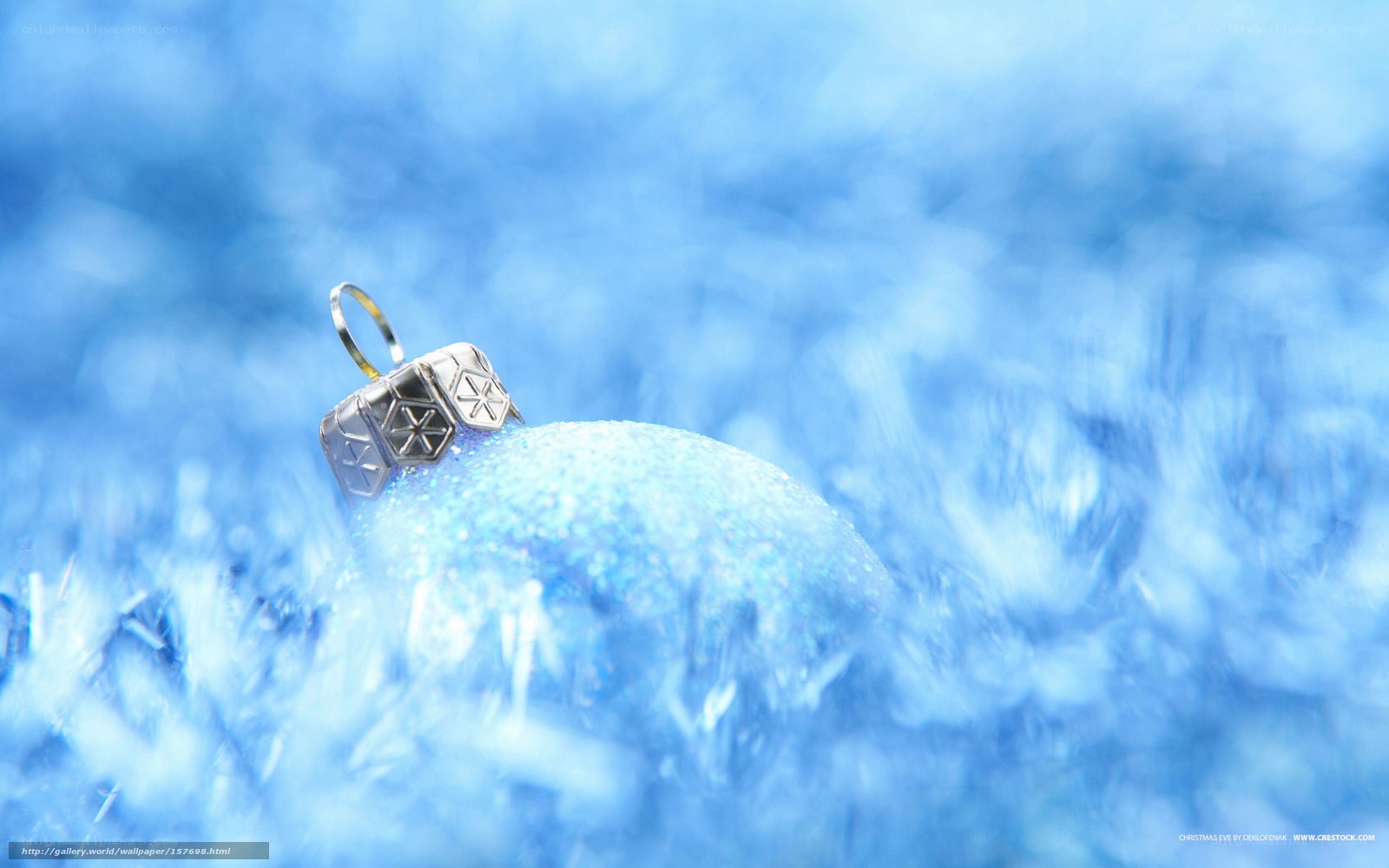 Blue ornament on snowy background