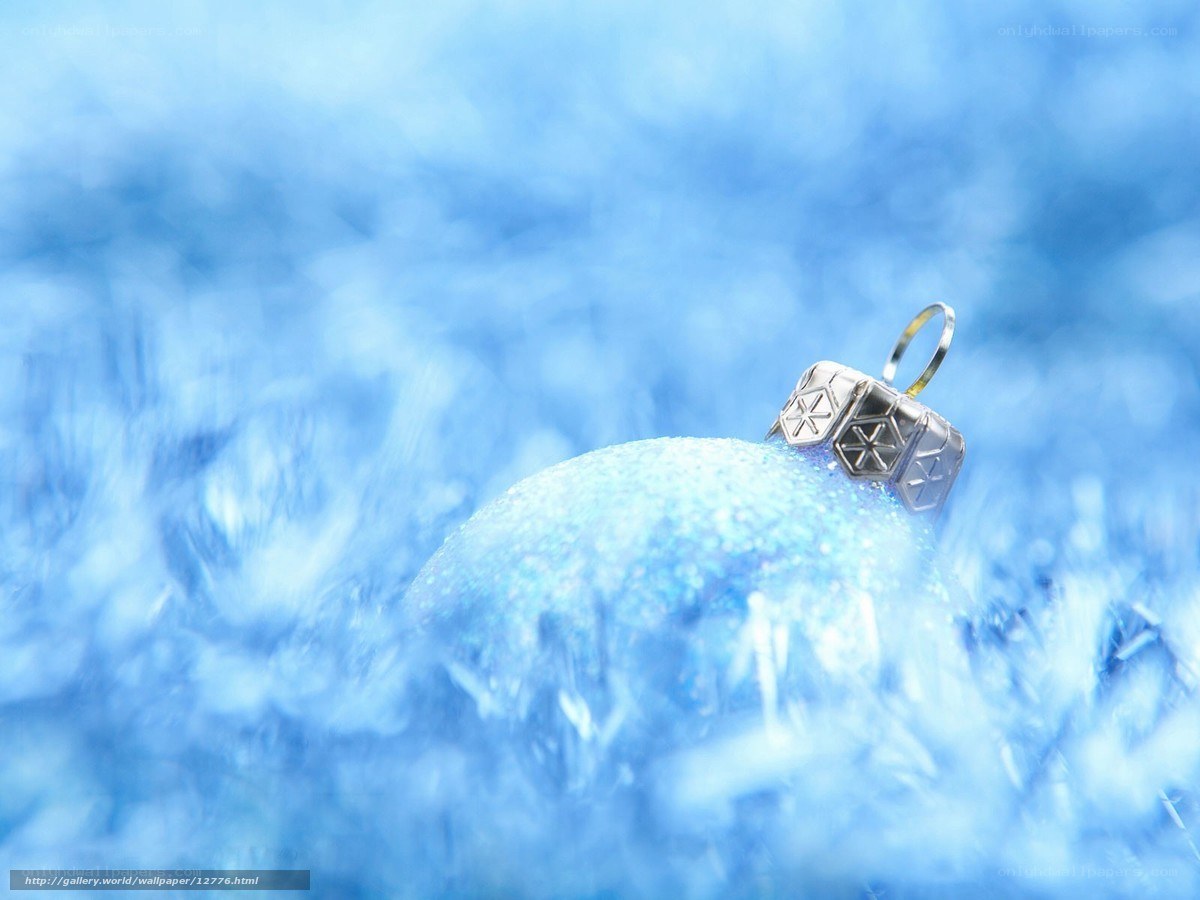 blue ornament on snowy background