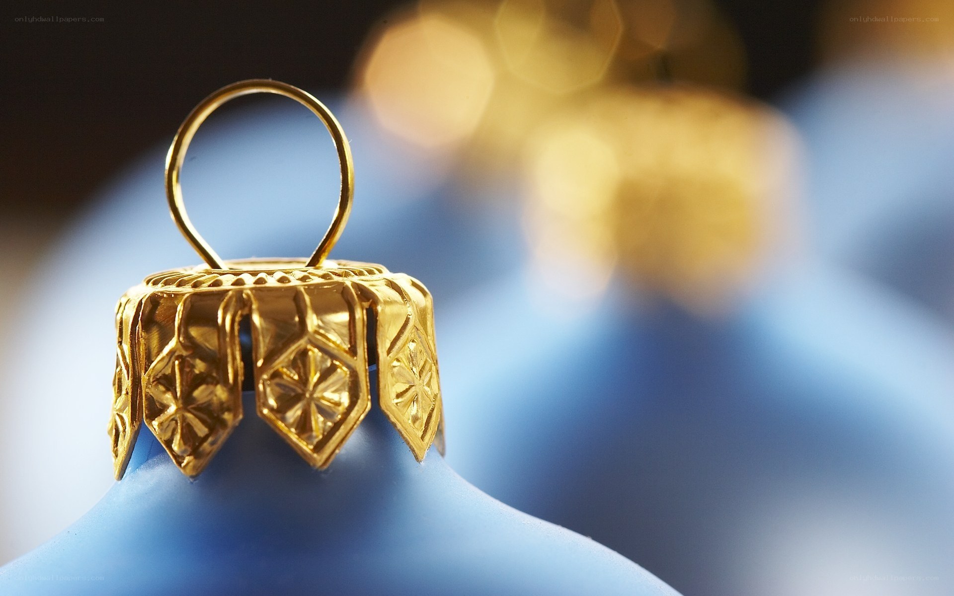 blue ornament with gold cap