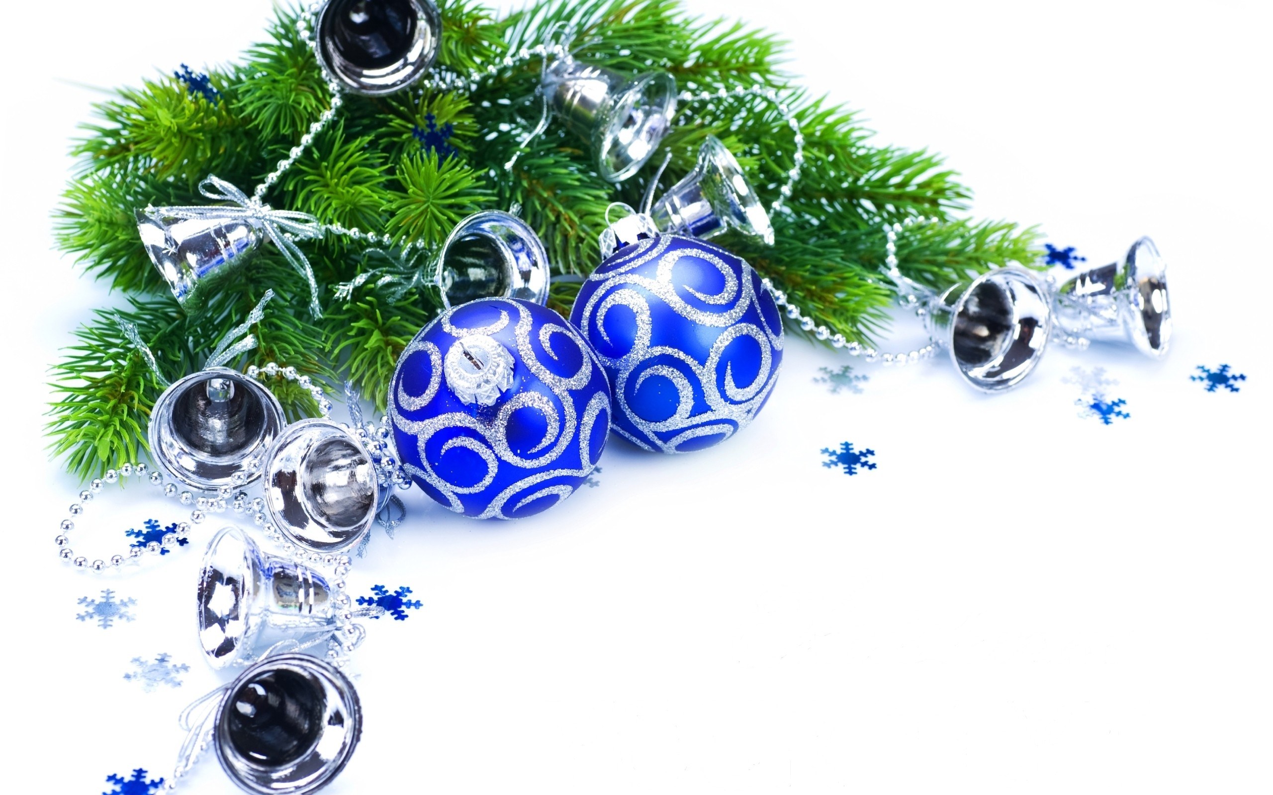 blue ornaments on pine branch