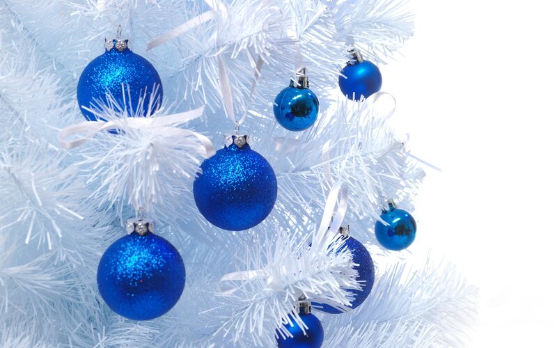 blue ornaments on white tree