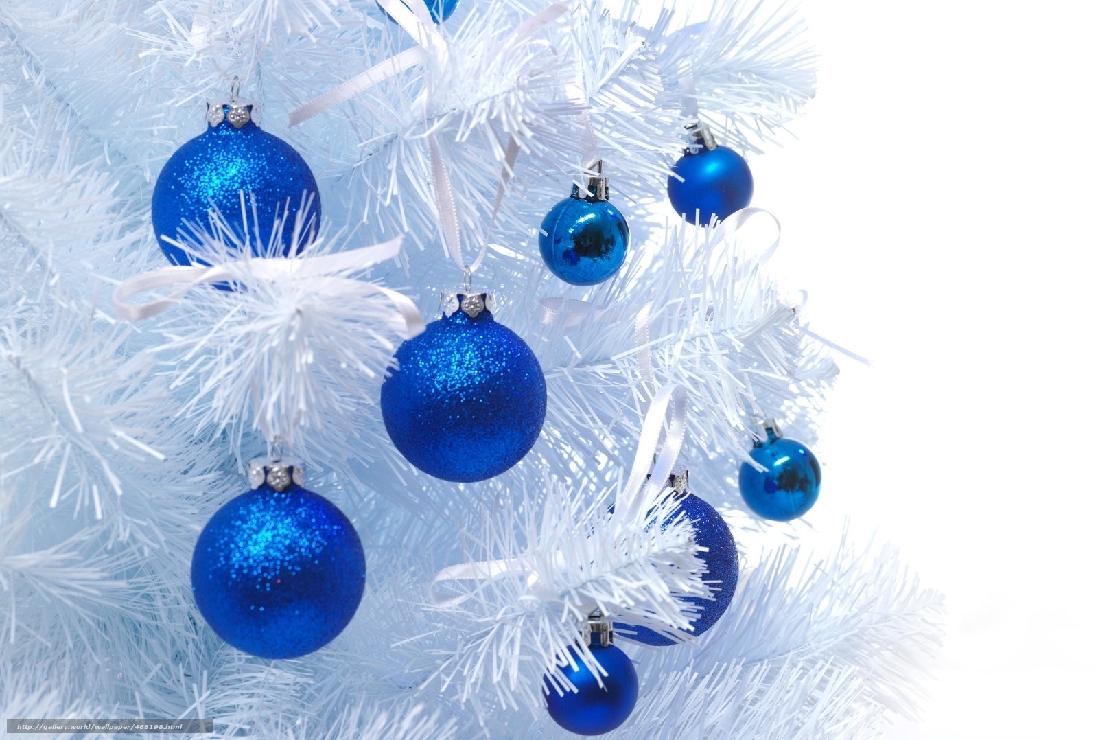 Blue ornaments on white tree