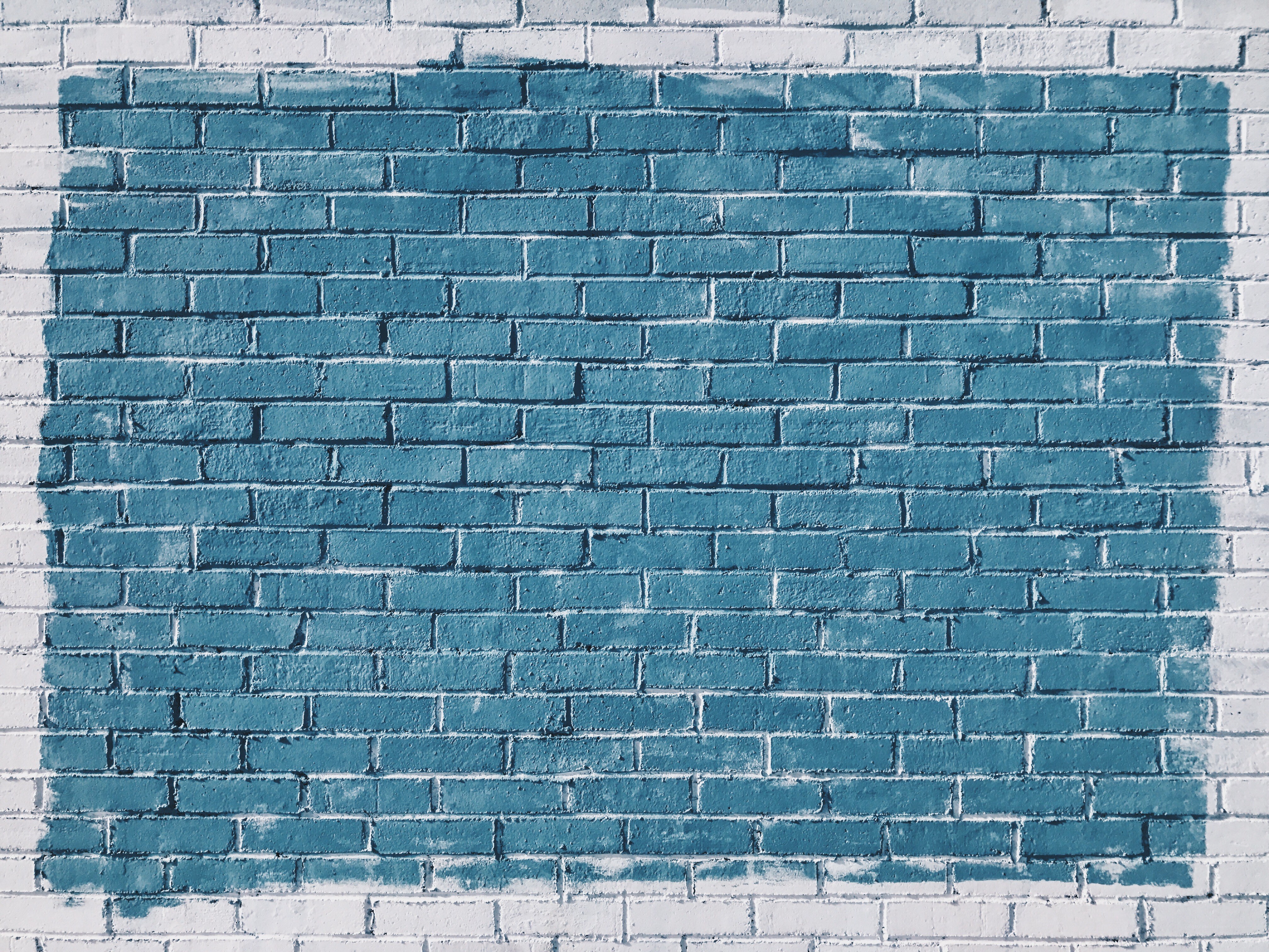 blue paint on brick wall