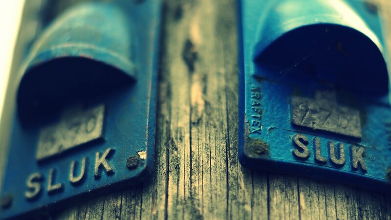 blue parking meters on wood