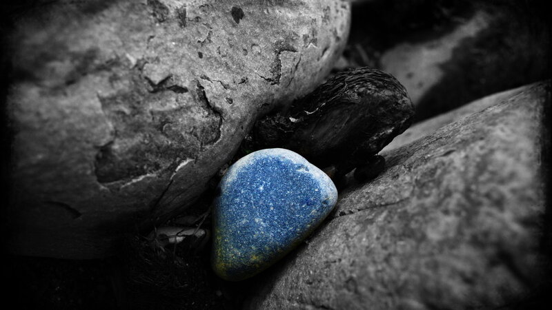 Blue Pebble Between Rocks