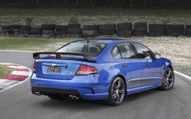 Blue Performance Sedan — Dynamic, Afternoon