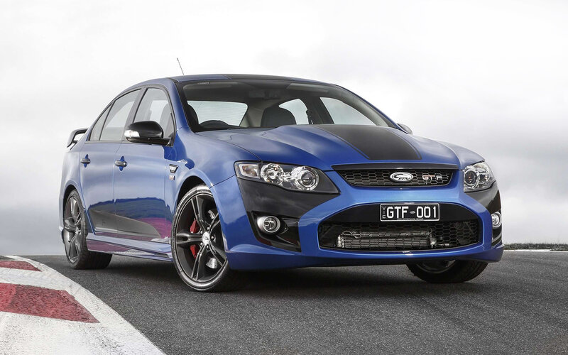 Blue Performance Sedan — Dynamic, Photograph
