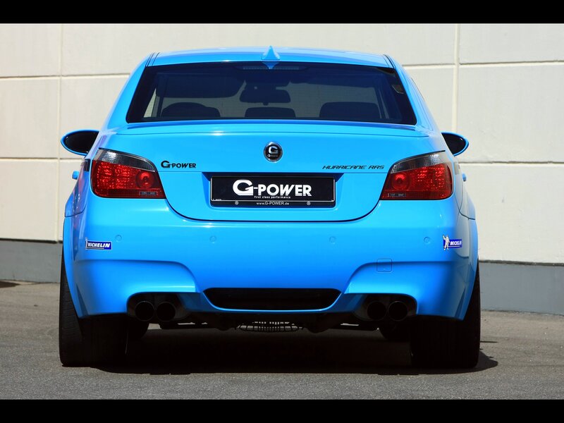 blue performance sedan rear view