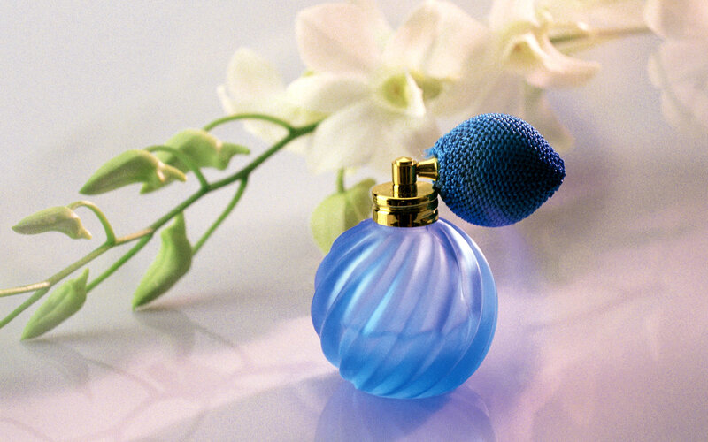 Blue perfume bottle with flowers