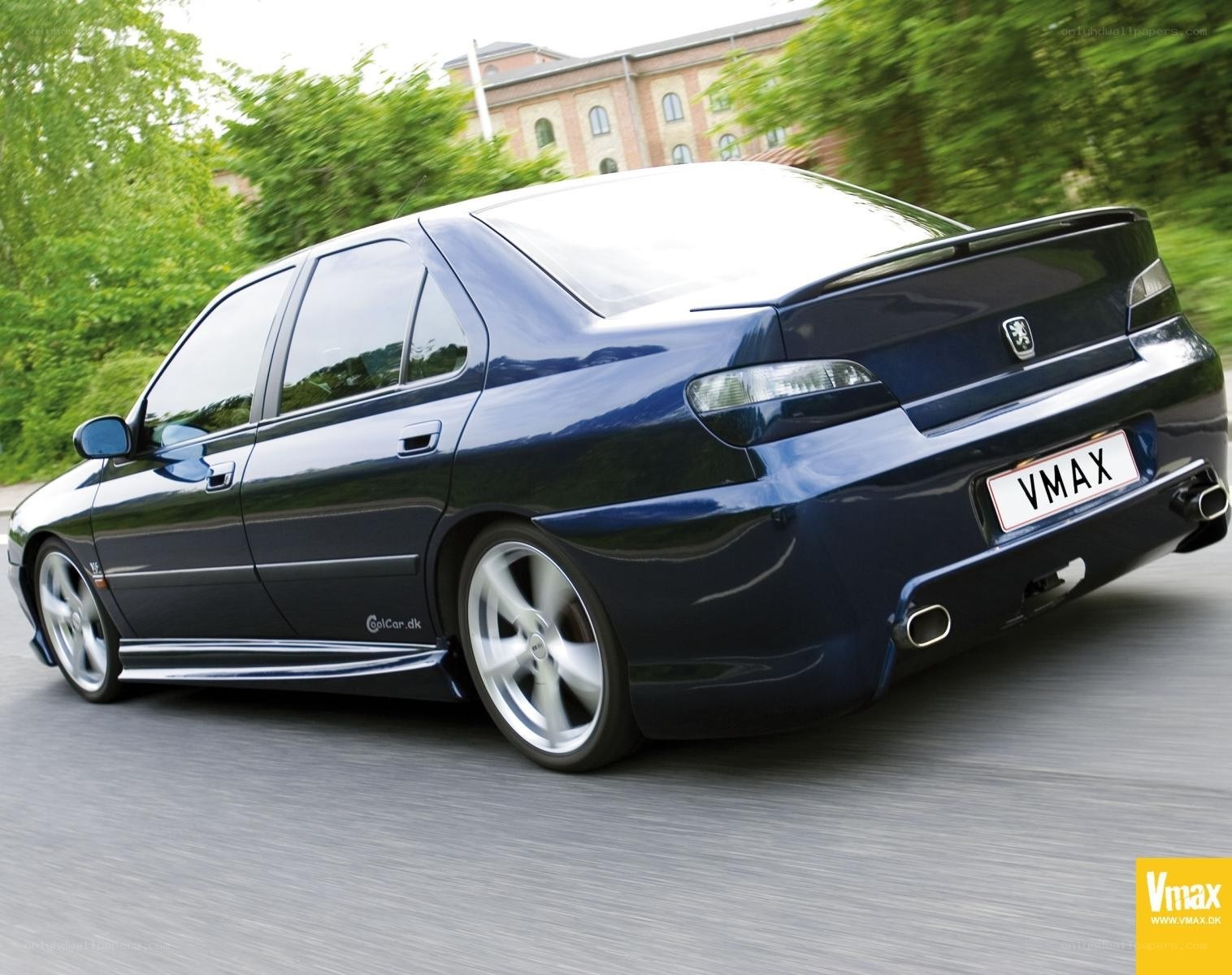 blue peugeot in motion