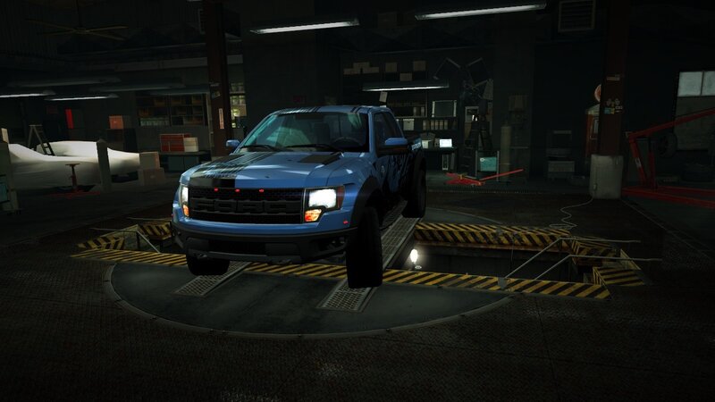 blue pickup truck in garage