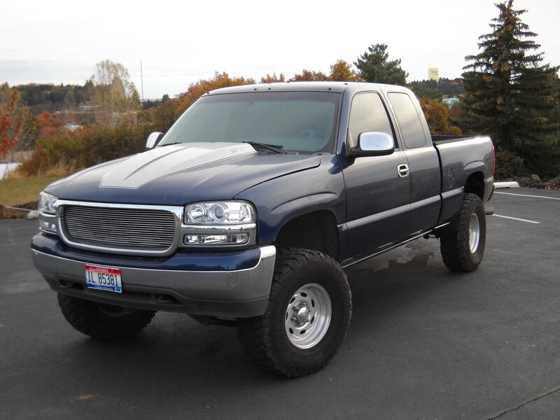 blue pickup truck in parking lot