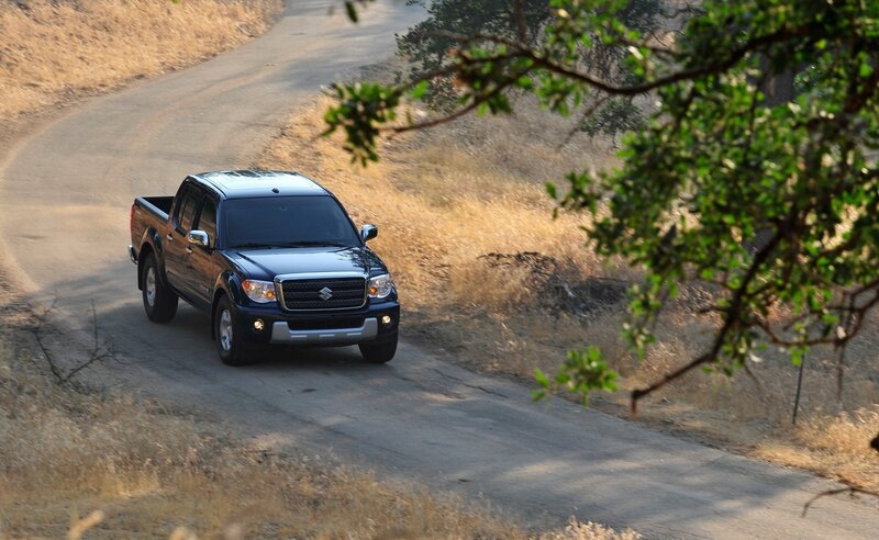 blue pickup truck on dirt road