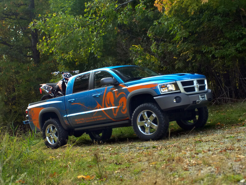 Blue pickup truck with dirt bike