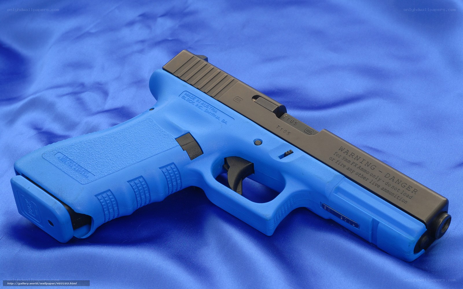 blue pistol on fabric