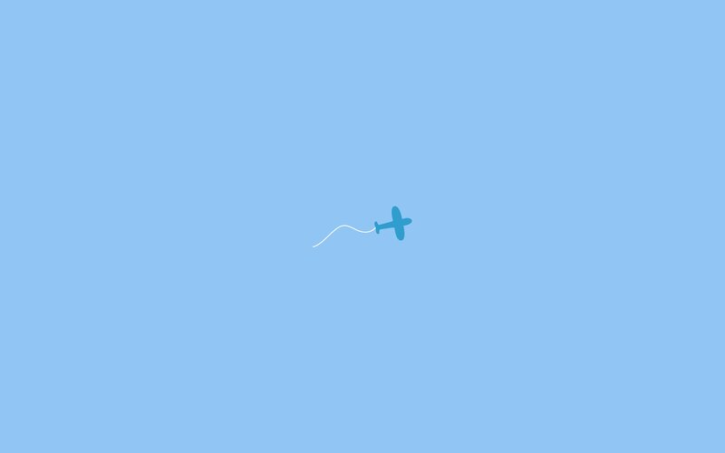 blue plane flying in sky