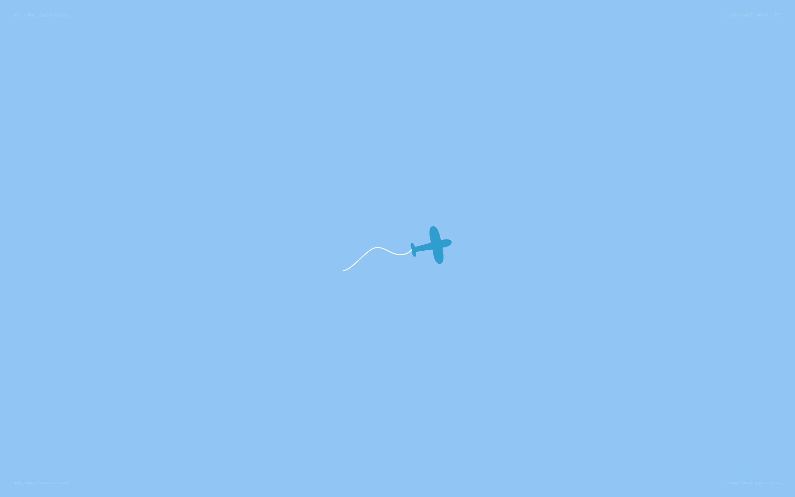 blue plane flying in sky