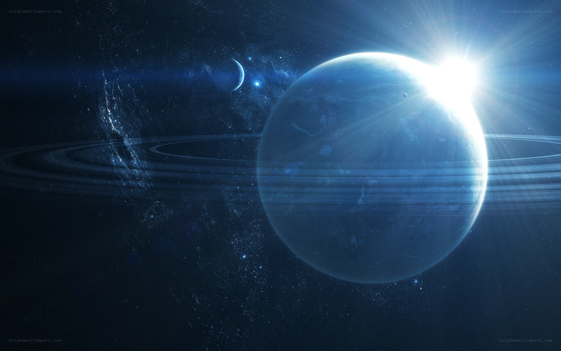 Blue planet with rings in space