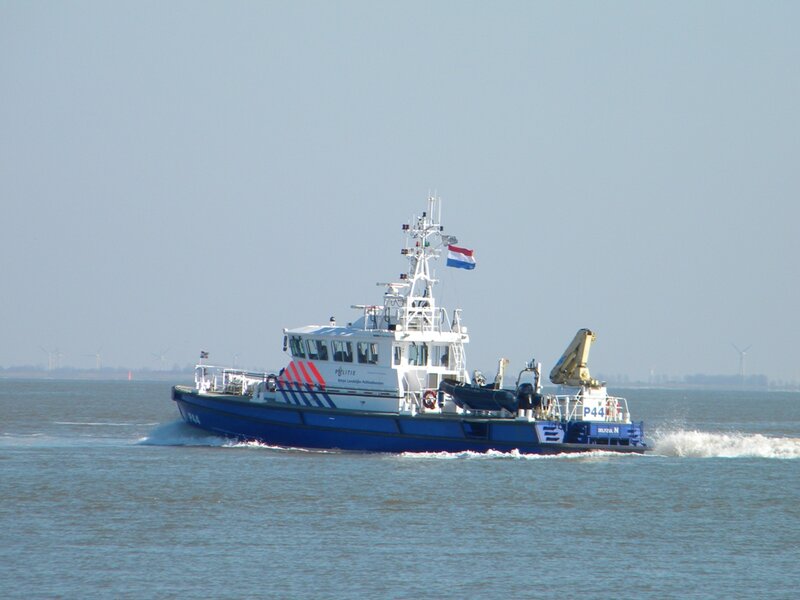 Blue Police Boat — Calm, Afternoon, Photograph