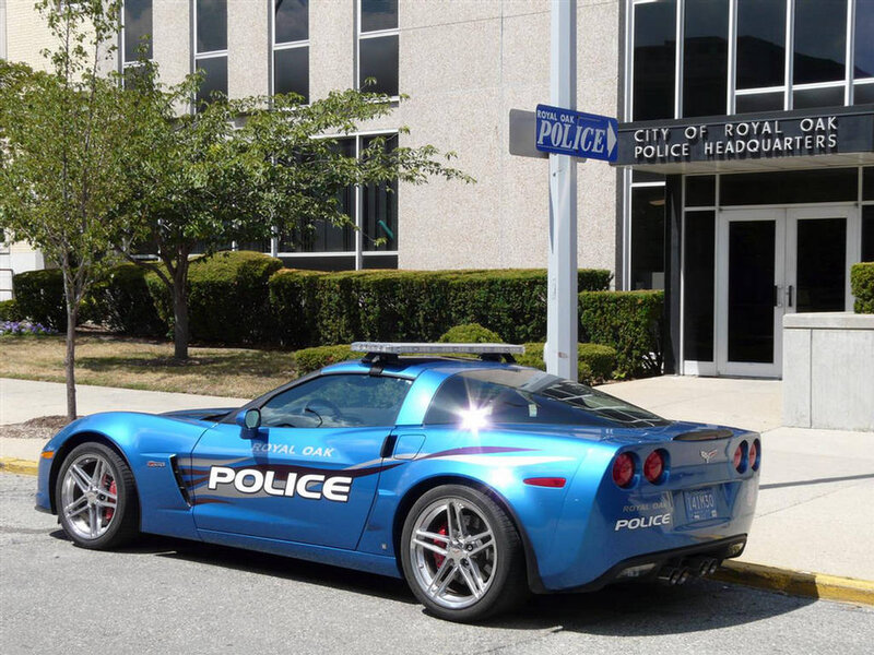 Blue Police Car — Neutral, Afternoon, Photograph, Building