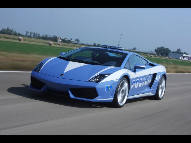 blue police lamborghini on track