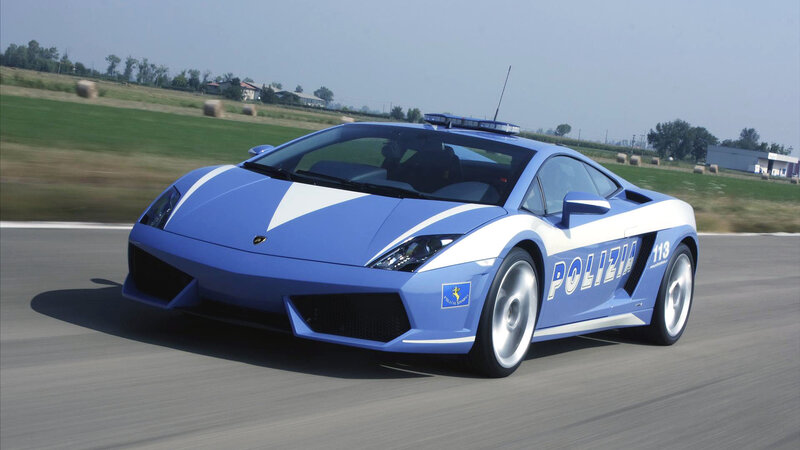 blue police lamborghini on track