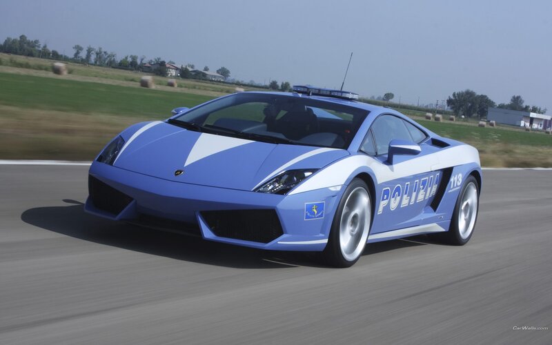 blue police lamborghini on track