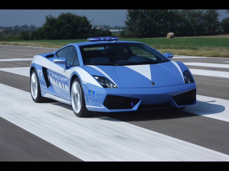 blue police lamborghini on track