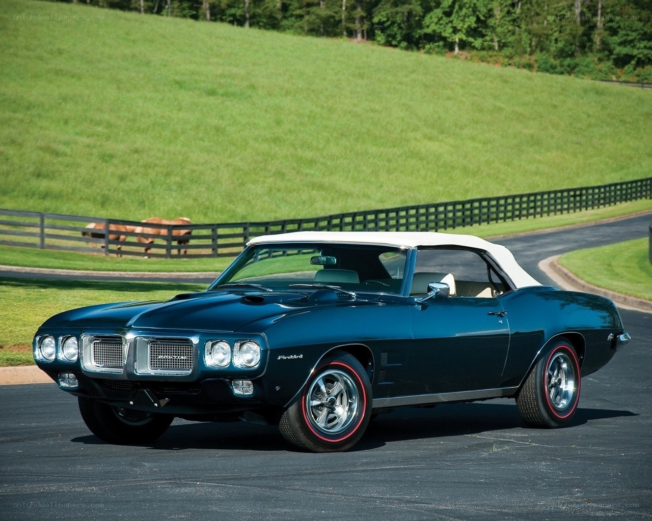 Blue Pontiac Firebird convertible