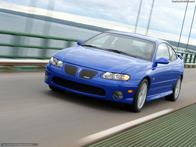 blue pontiac gto on a bridge
