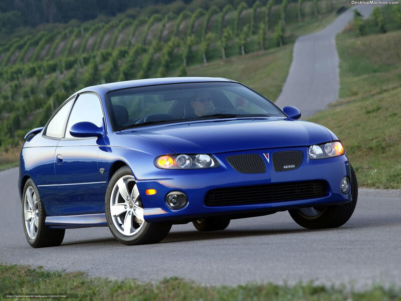 blue pontiac gto on country road