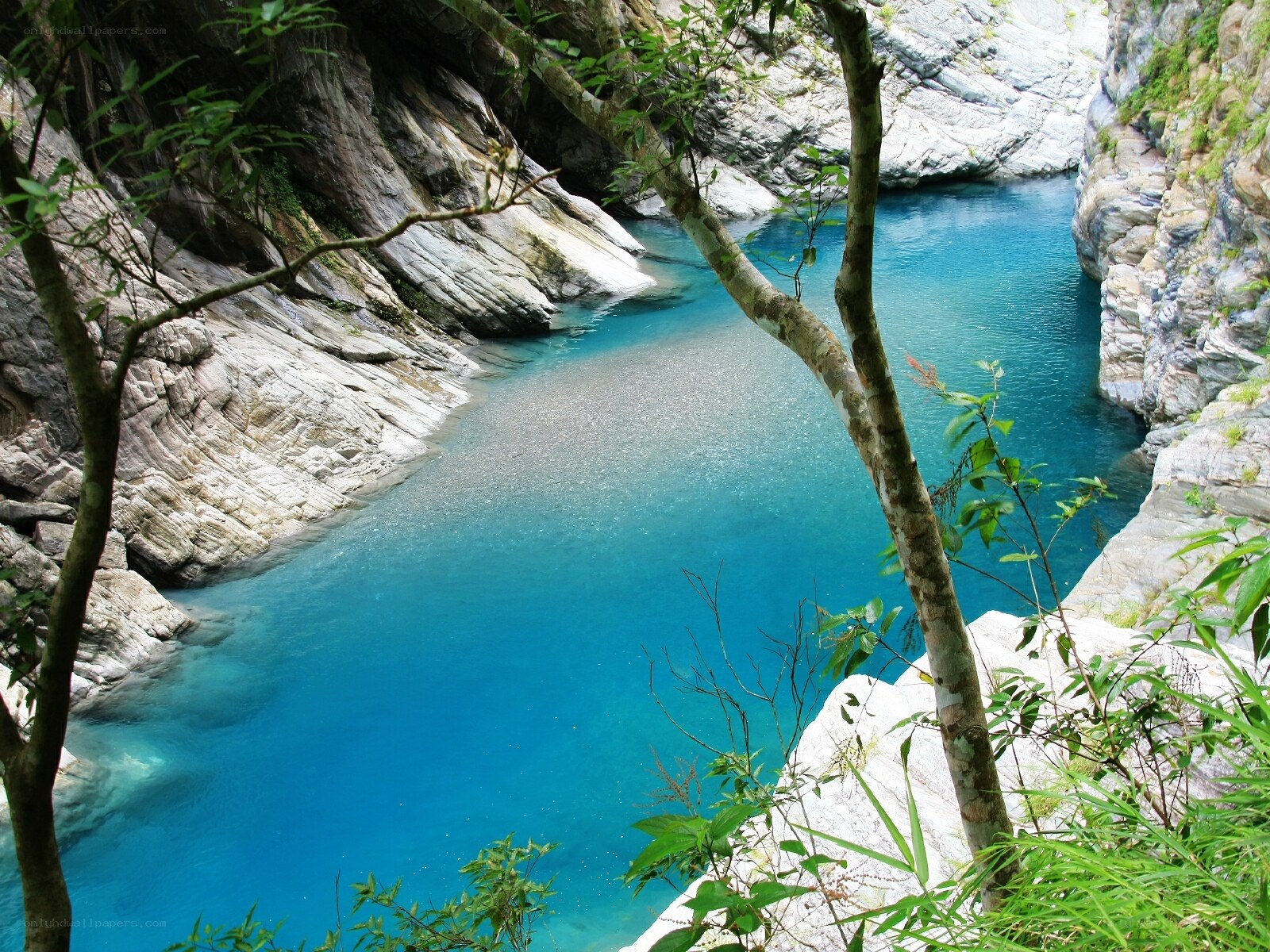 Blue pool in a rocky canyon