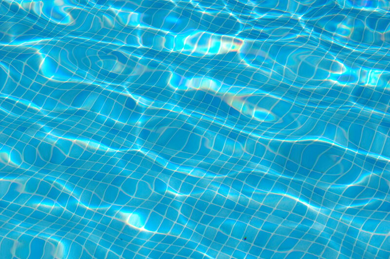 Blue pool tiles under water