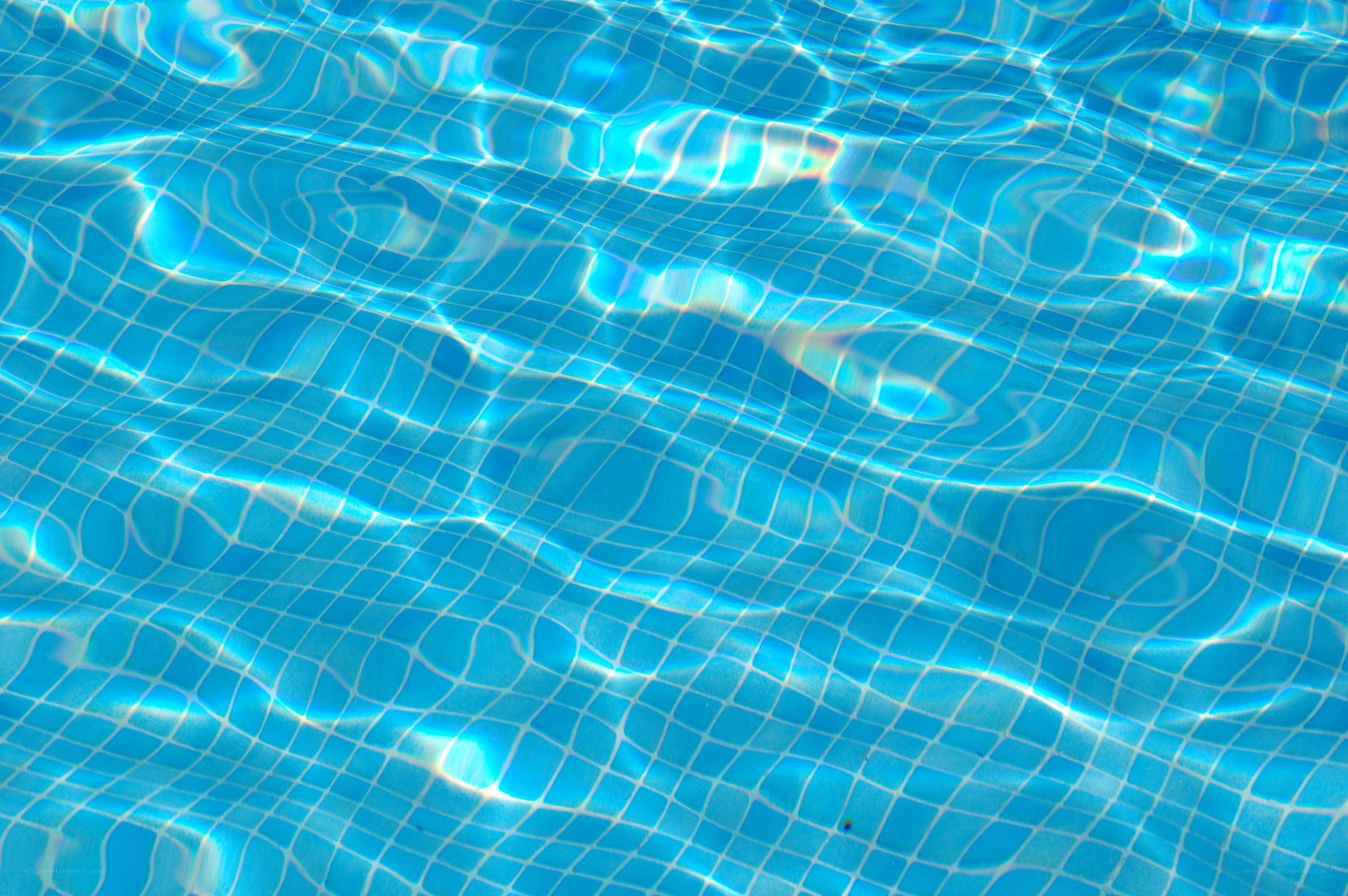 Blue pool tiles under water