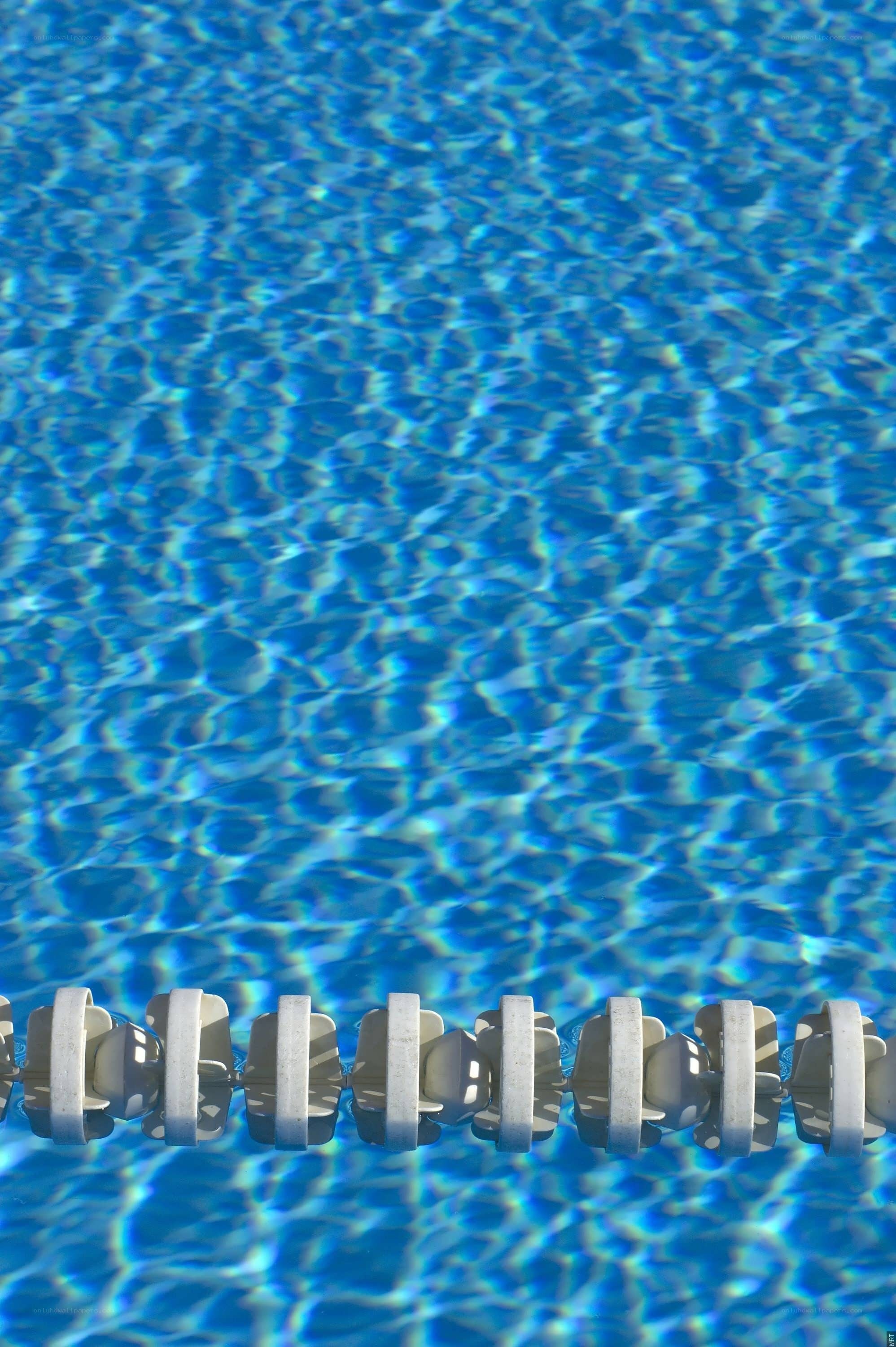 blue pool water with lane line