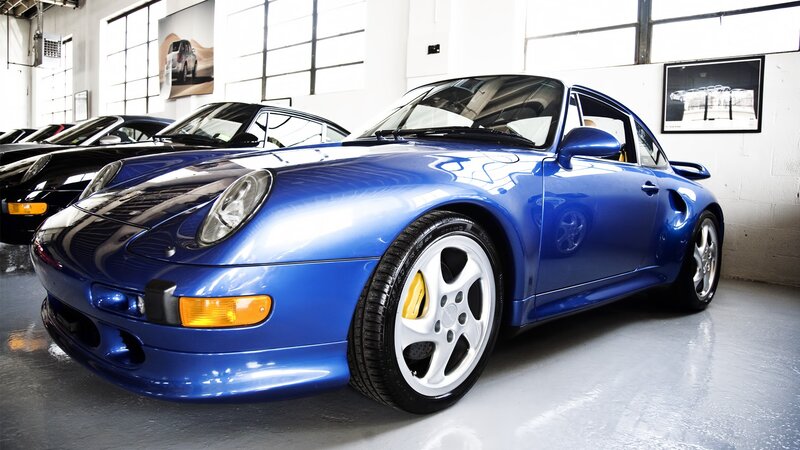 Blue Porsche 911 in showroom