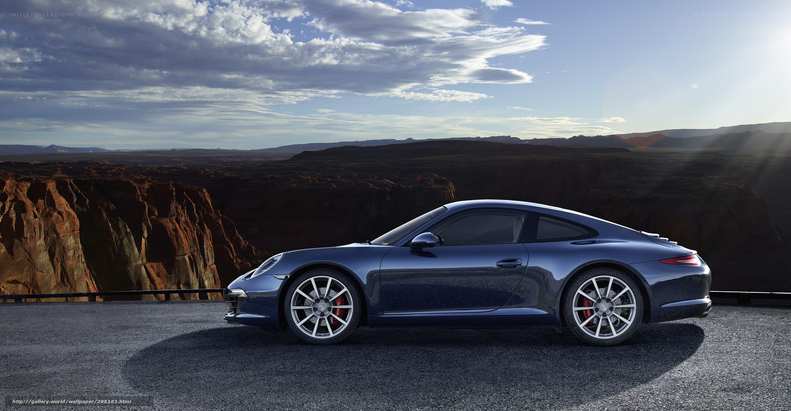 Blue Porsche 911 on canyon overlook