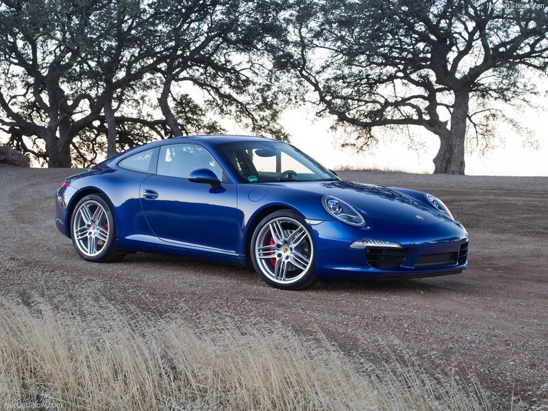 blue porsche 911 on dirt road