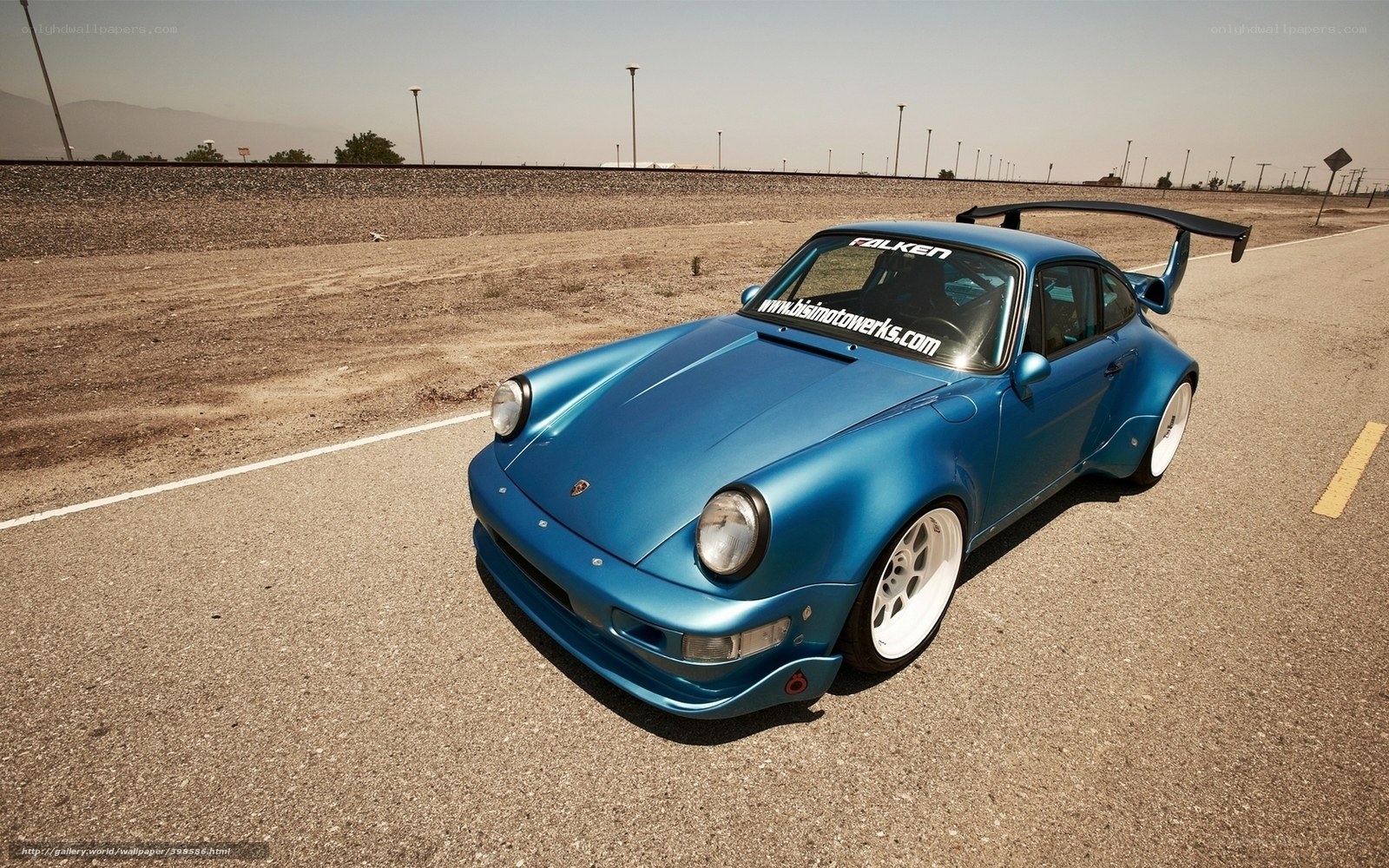 blue porsche 911 on track