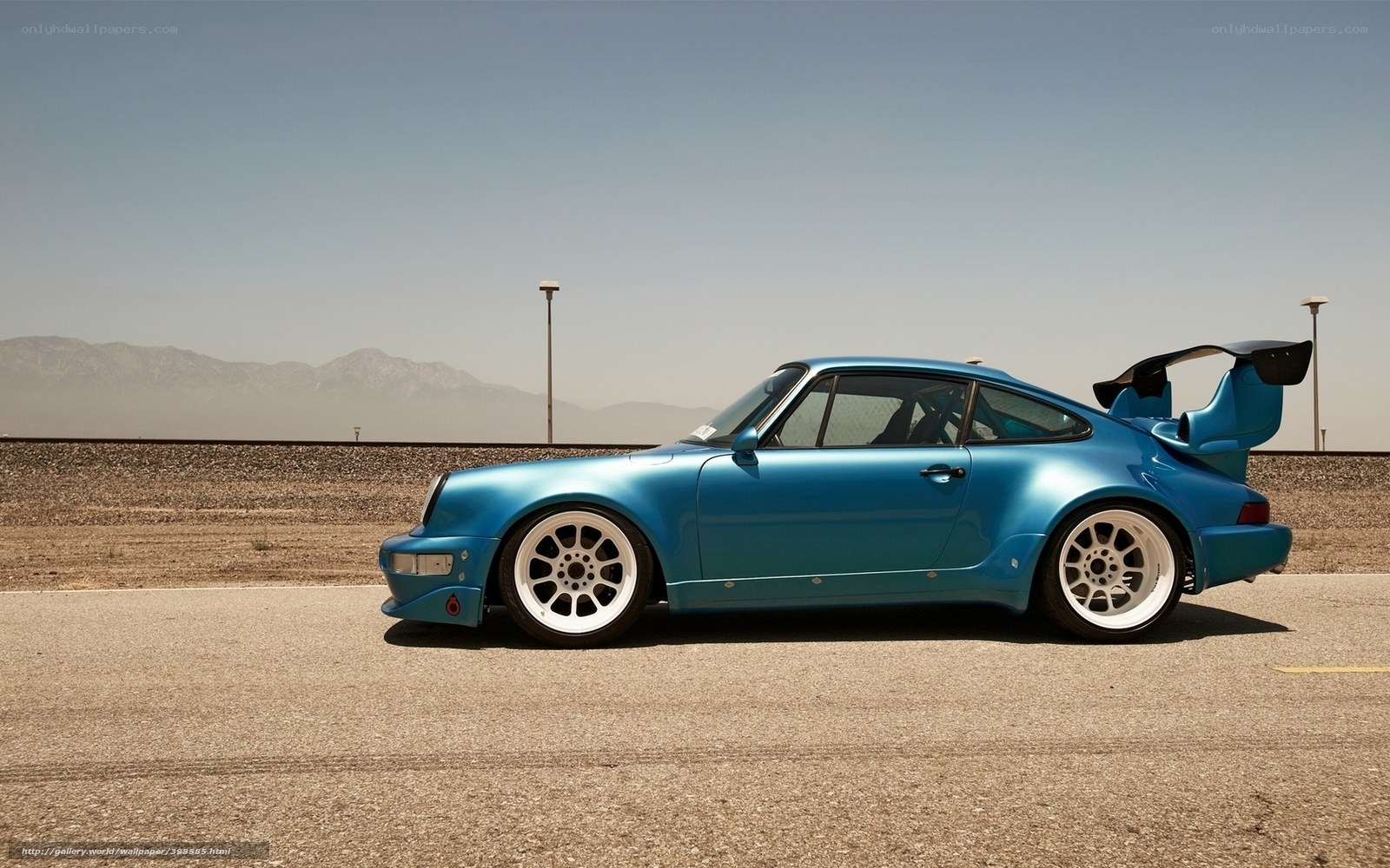 blue porsche 911 with large wing