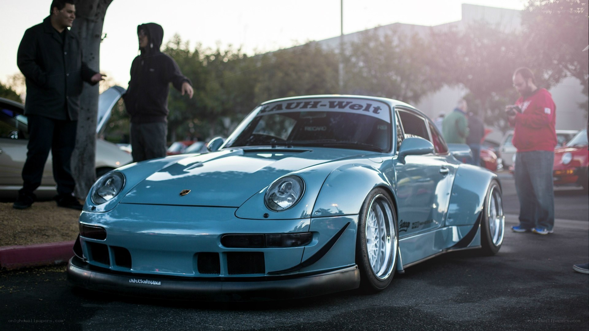 blue porsche at car show