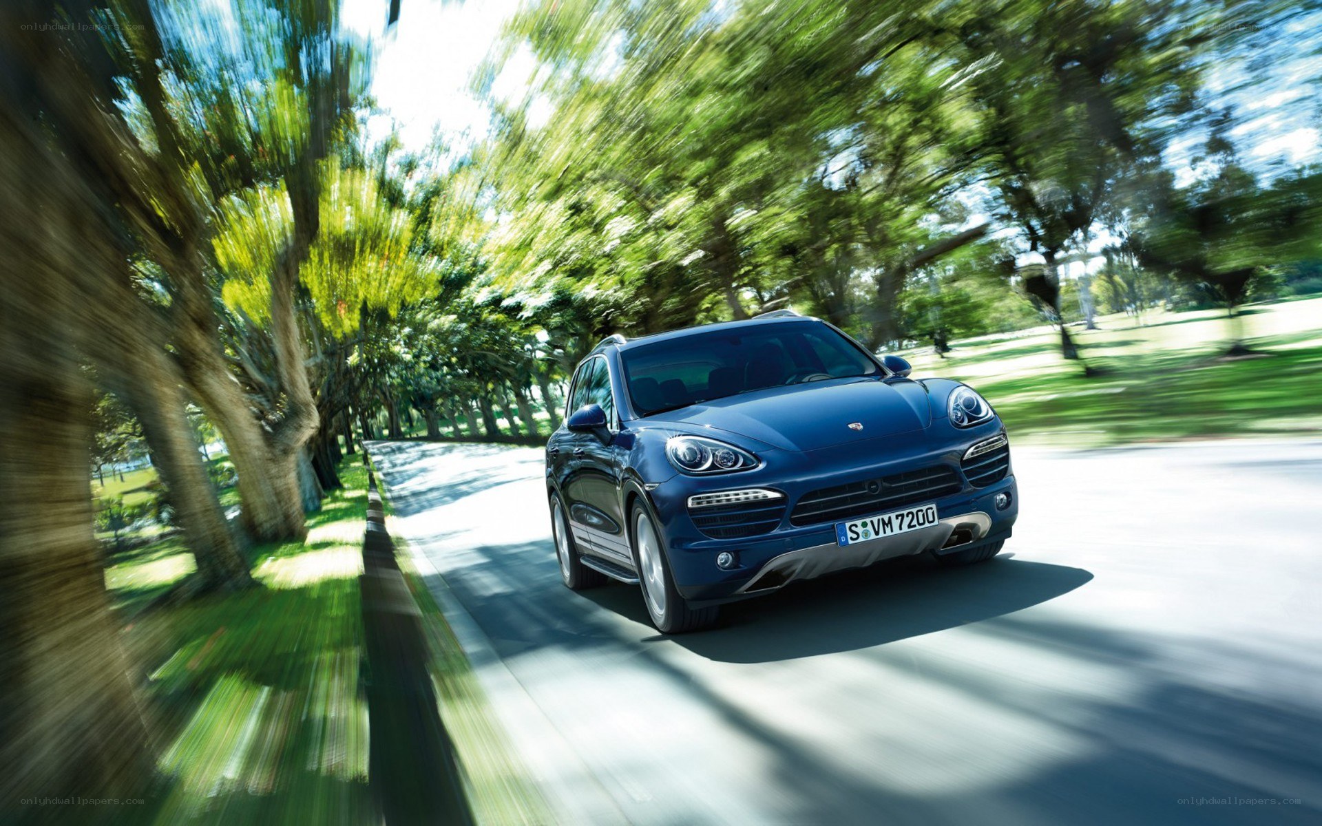 Blue Porsche Cayenne in motion