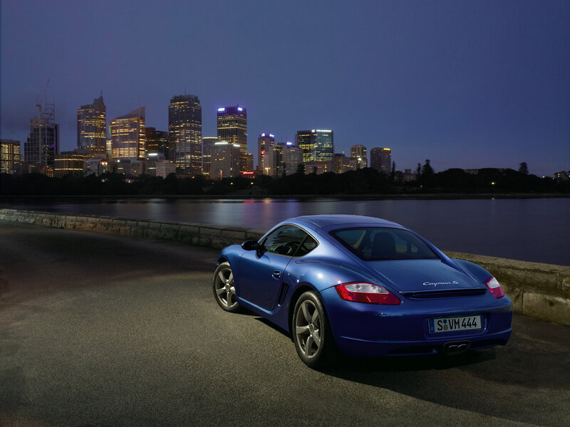 Blue Porsche Cayman S at dusk