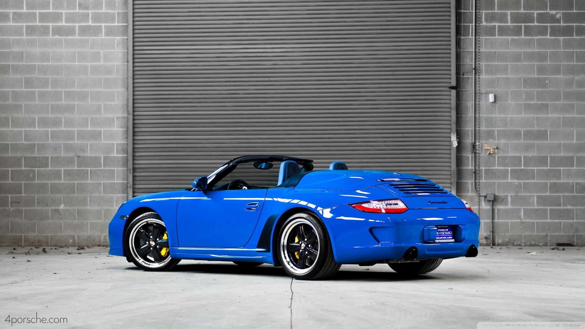 blue porsche convertible car