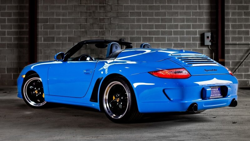 blue porsche convertible sports car
