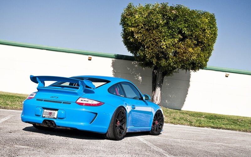Blue Porsche GT3 parked outside