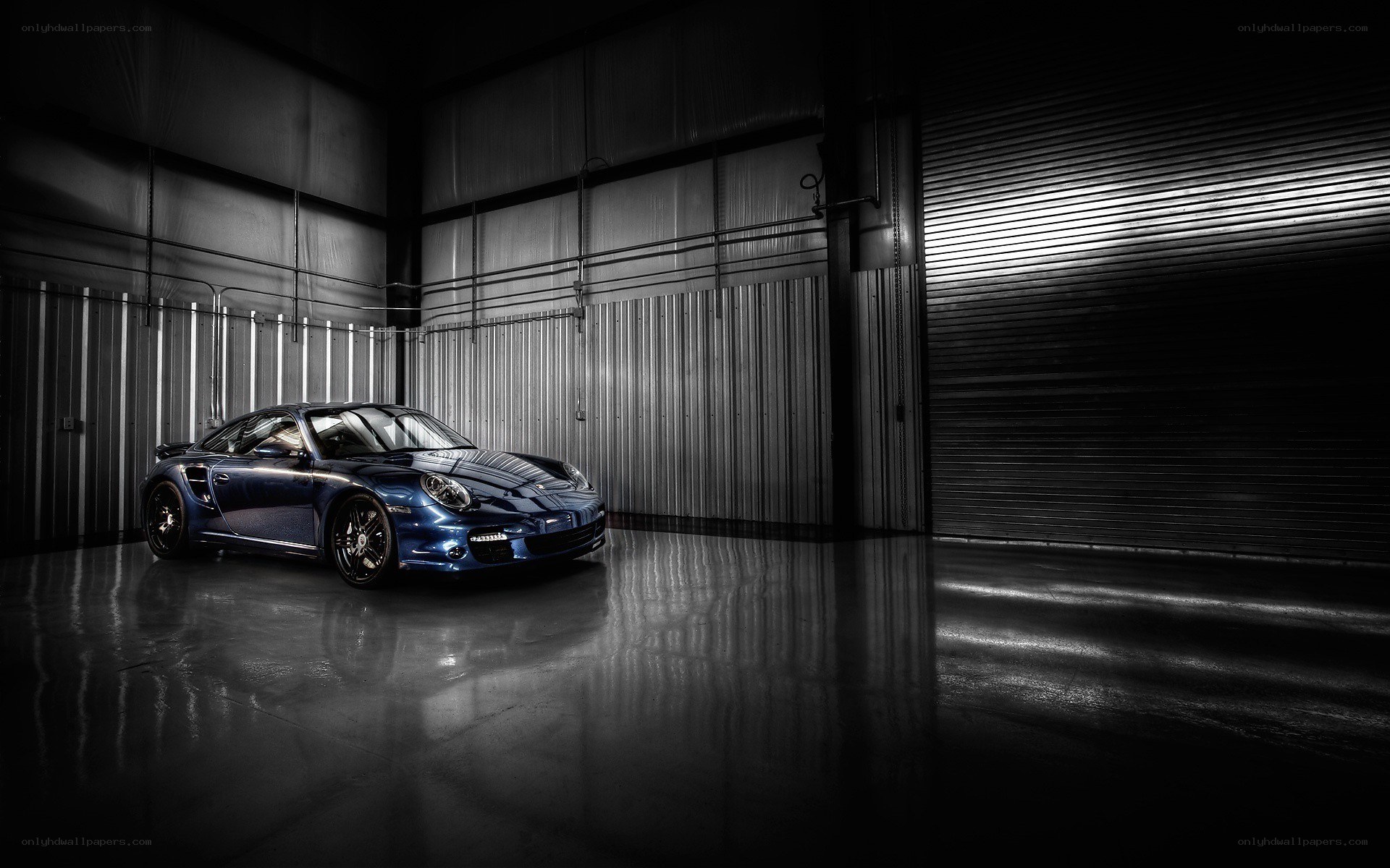 Blue Porsche in a warehouse